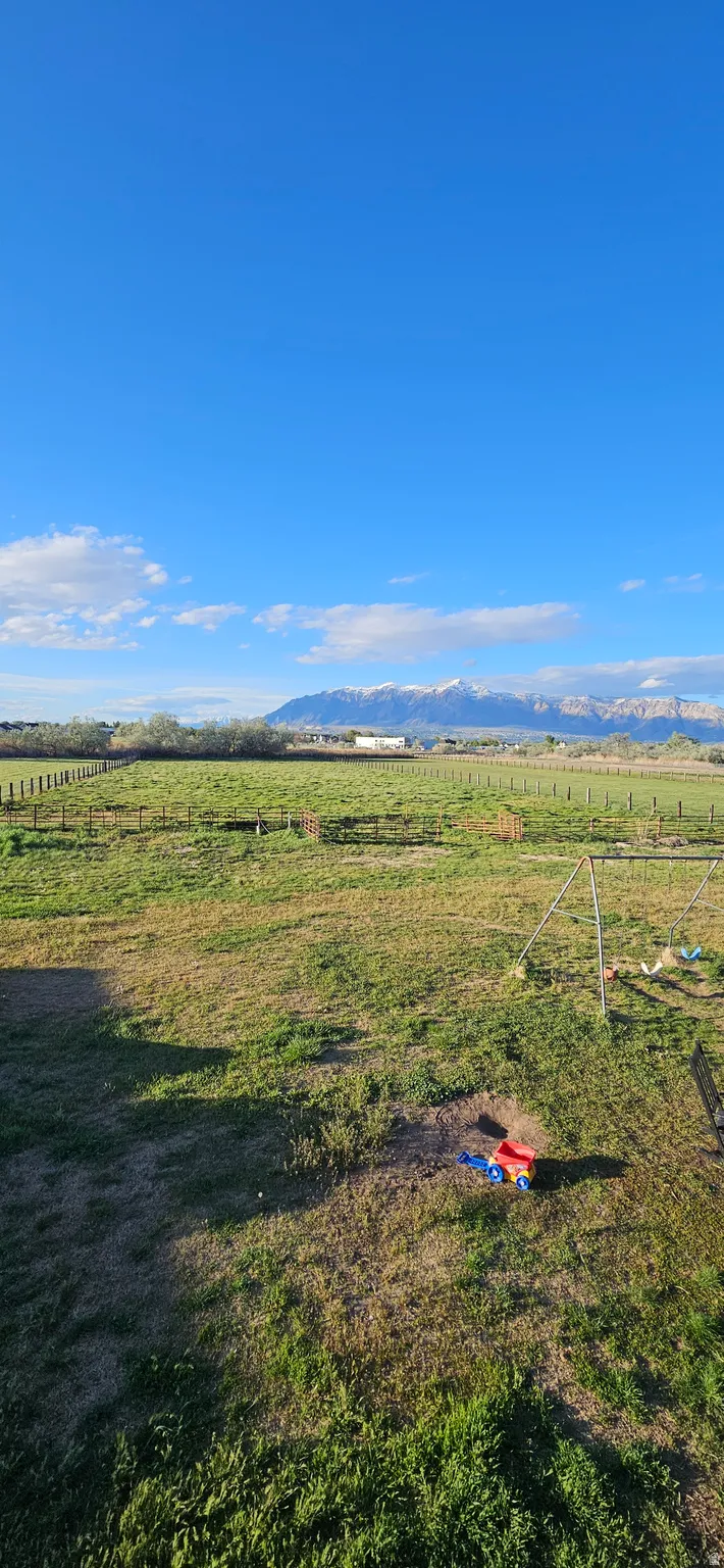 View of yard with a view of countryside and a mountain view