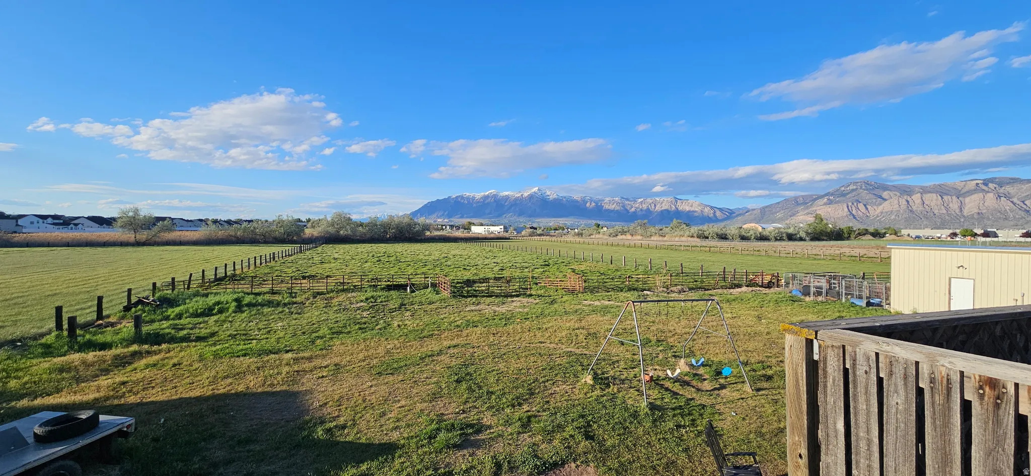 View of mountain backdrop featuring rural landscape