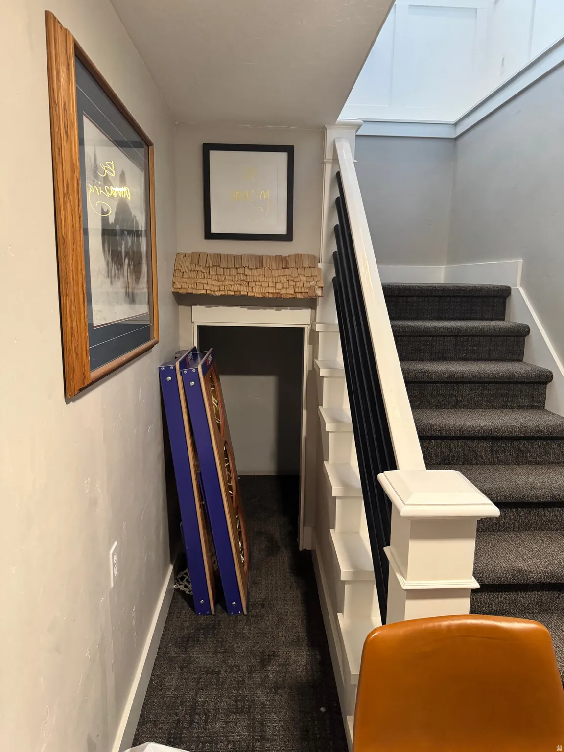 Stairs featuring carpet floors and baseboards