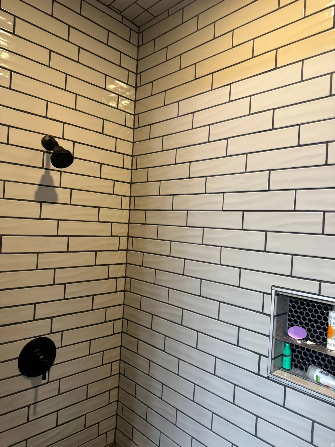 Full bath with a tile shower