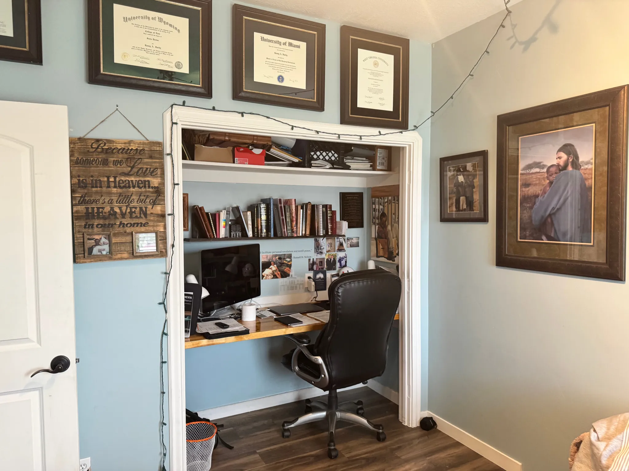Office space featuring dark wood-style floors and baseboards