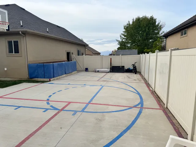 View of basketball court featuring a fenced backyard
