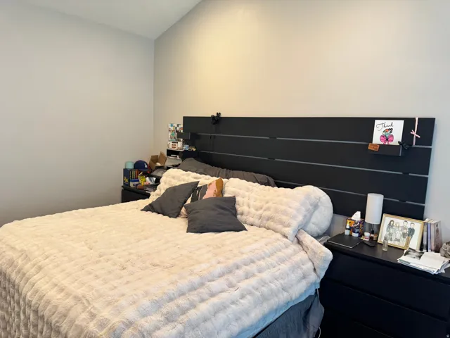 Bedroom featuring lofted ceiling