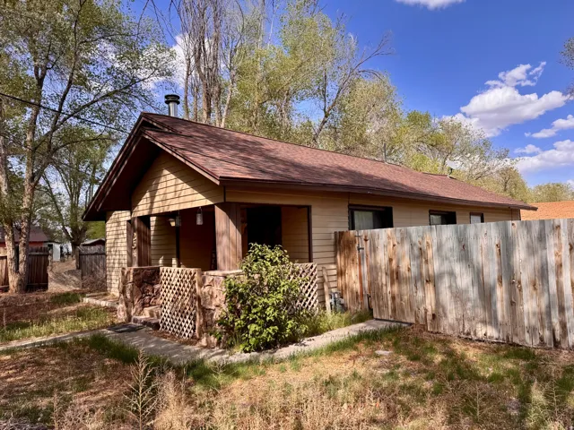 View of home's exterior with a shingled roof