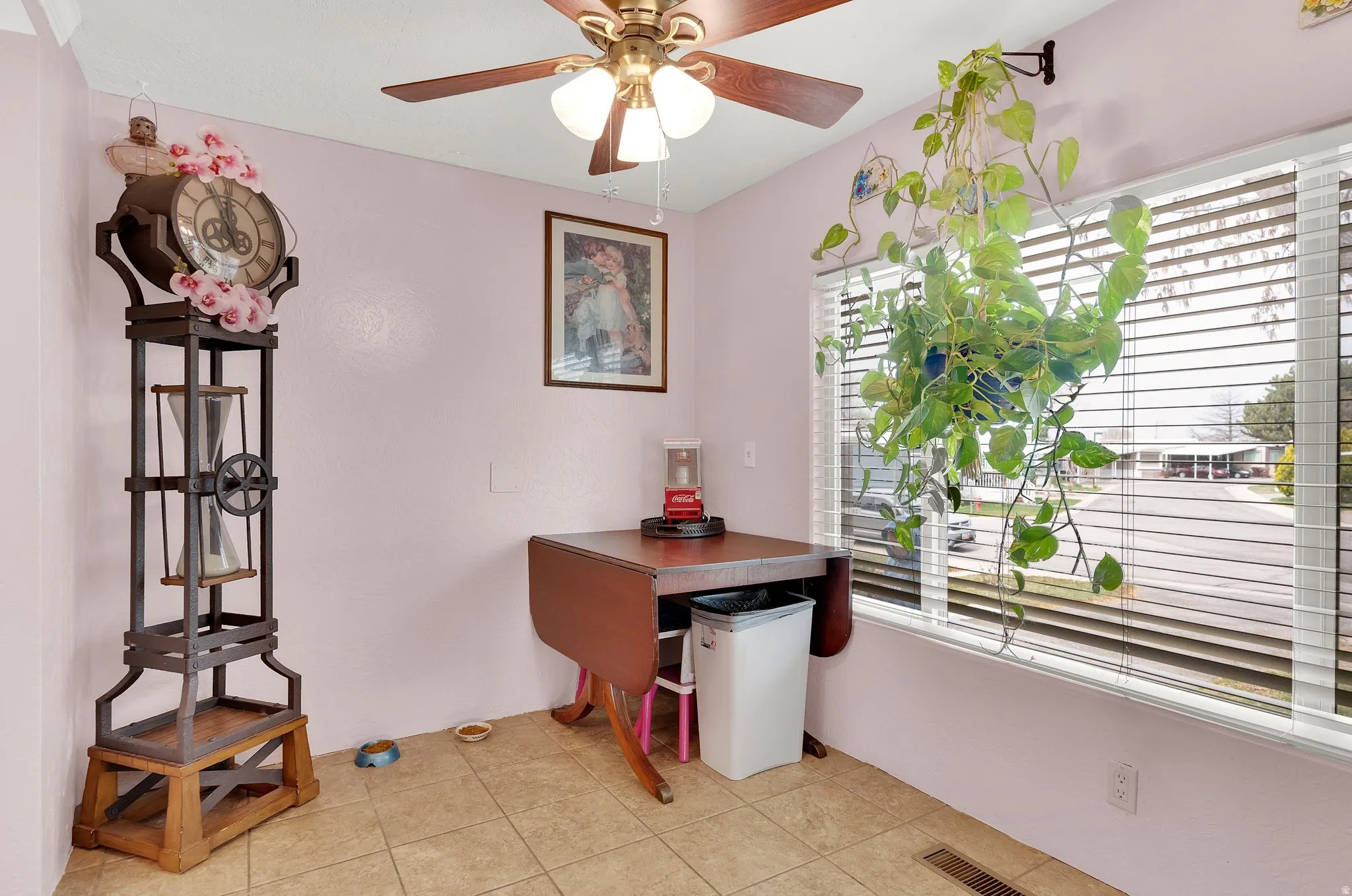 Dining area featuring ceiling fan and light tile patterned floors