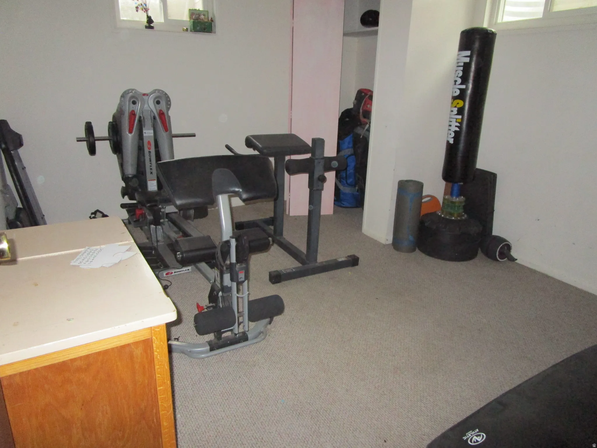 Workout area with light colored carpet