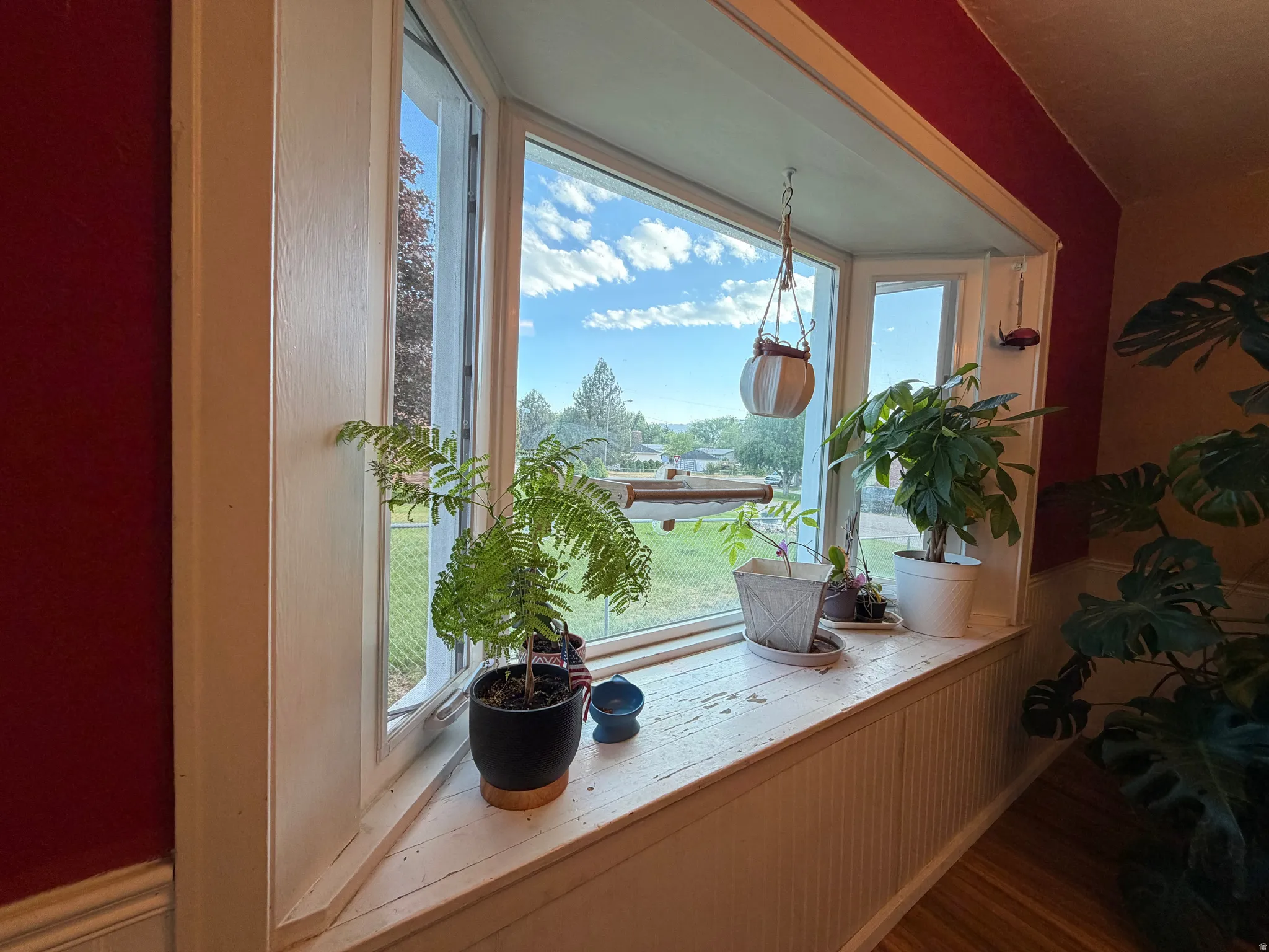 Bay window with white trim and a deep sill