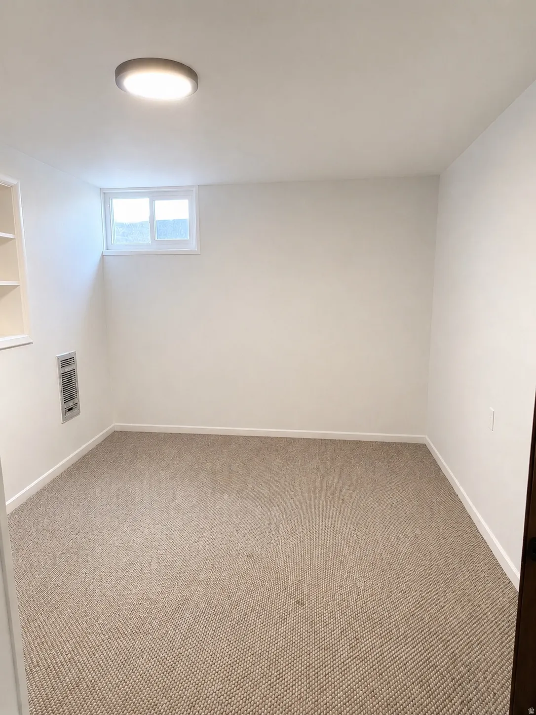 Neutral tone carpeting complementing light-colored walls