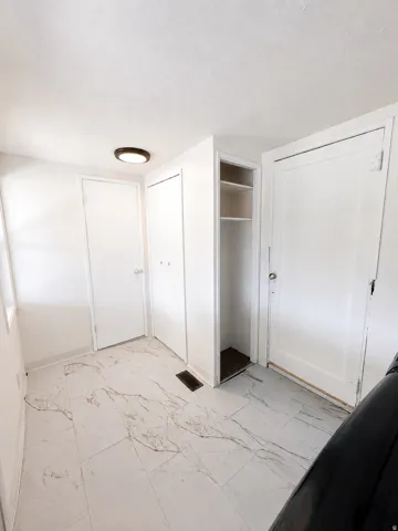 White tile flooring with subtle veining