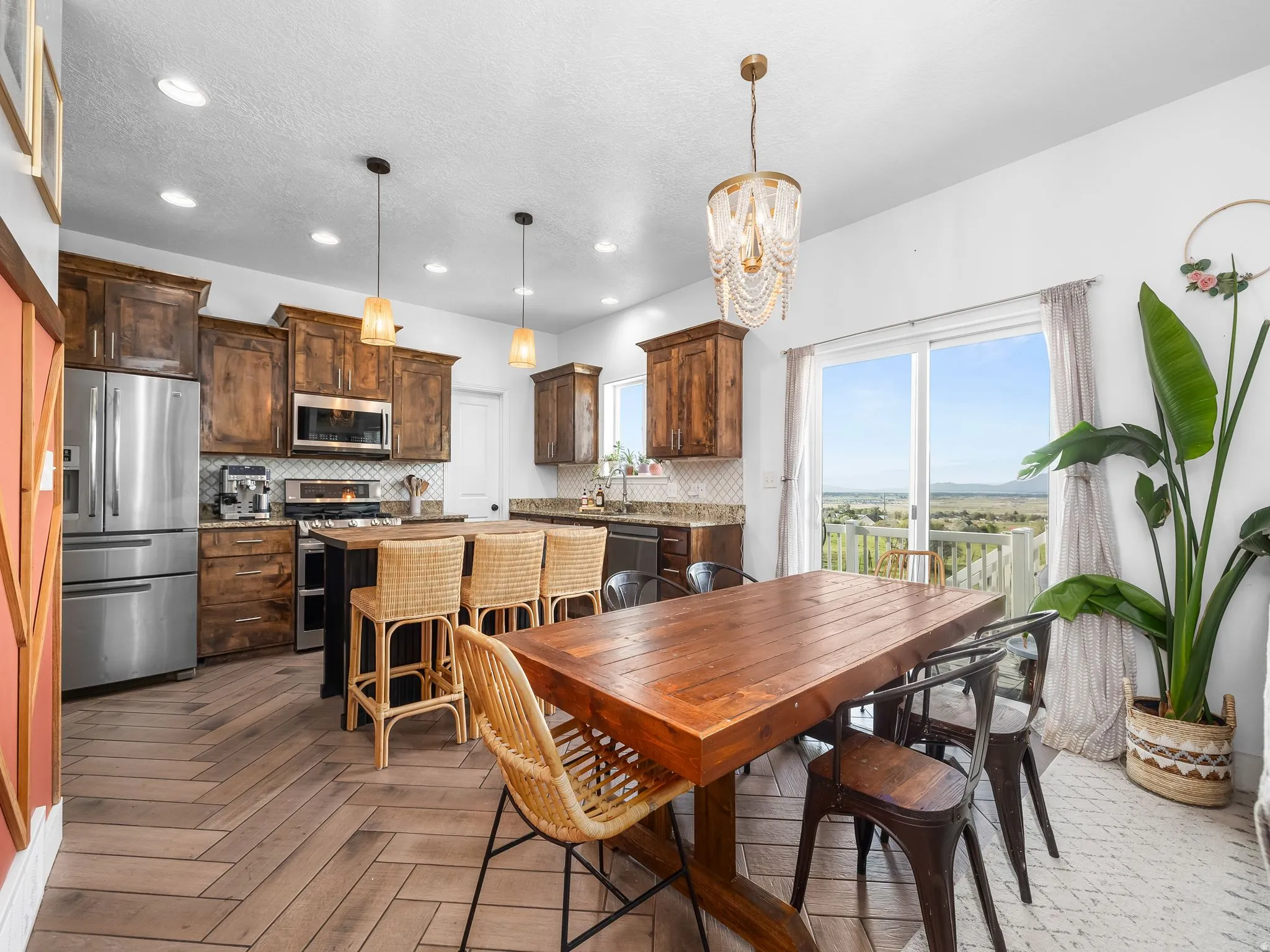 Dining room with a chandelier and parquet flooring