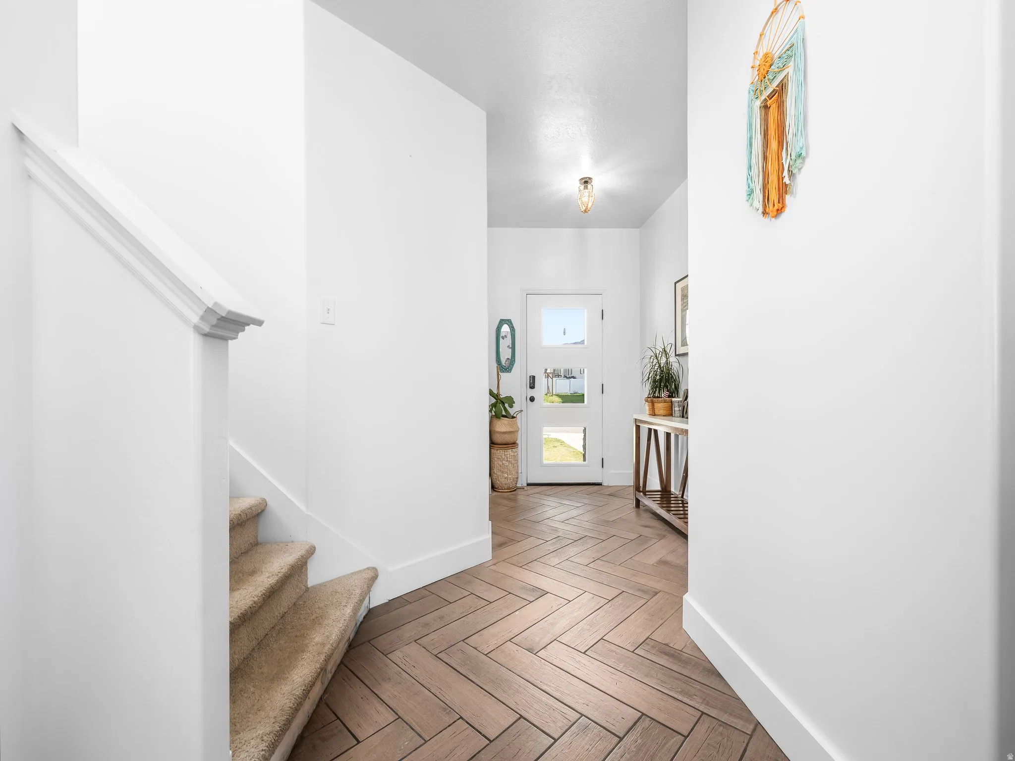 Entryway featuring stairs and parquet floors