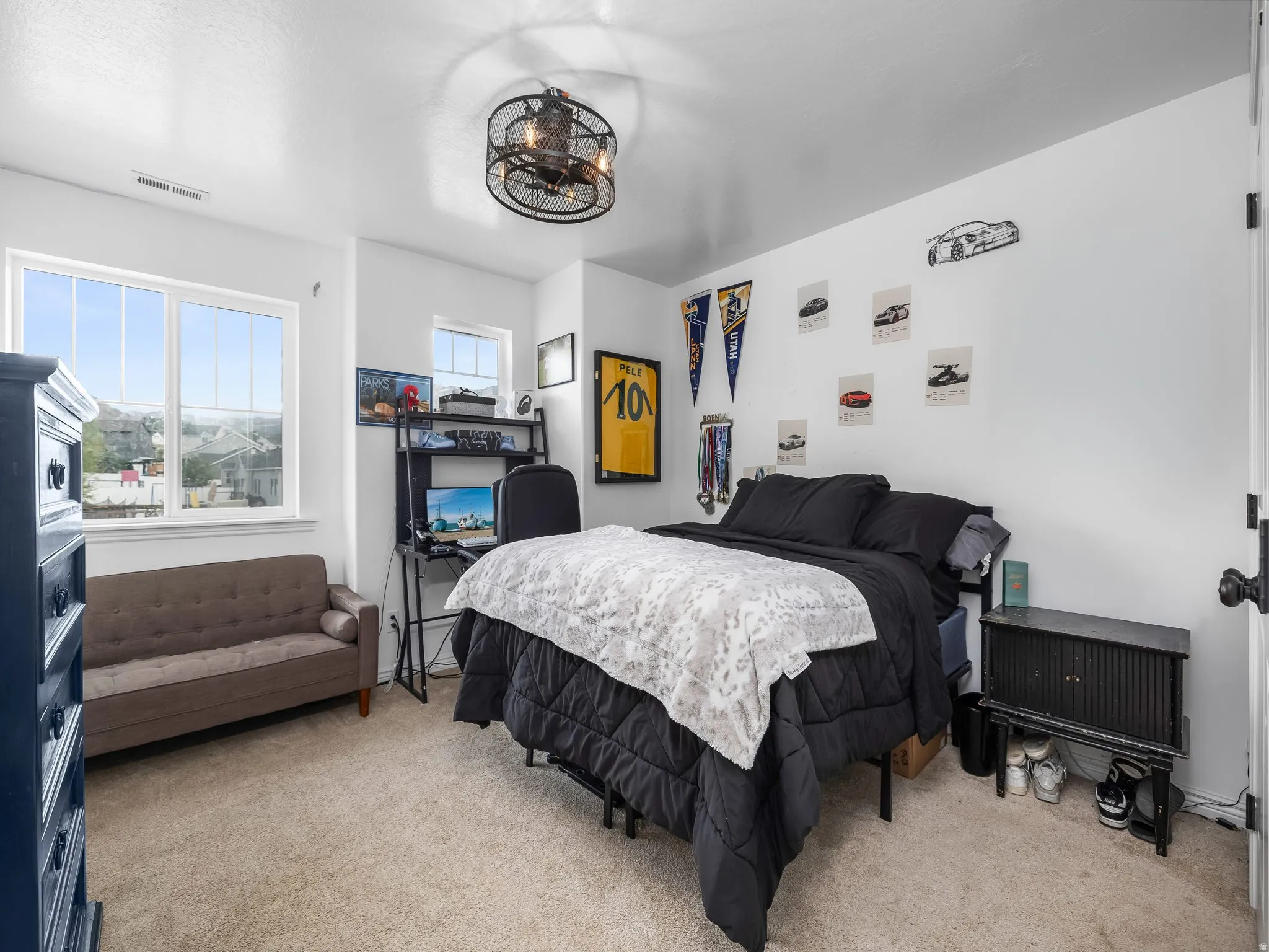 Bedroom featuring light carpet