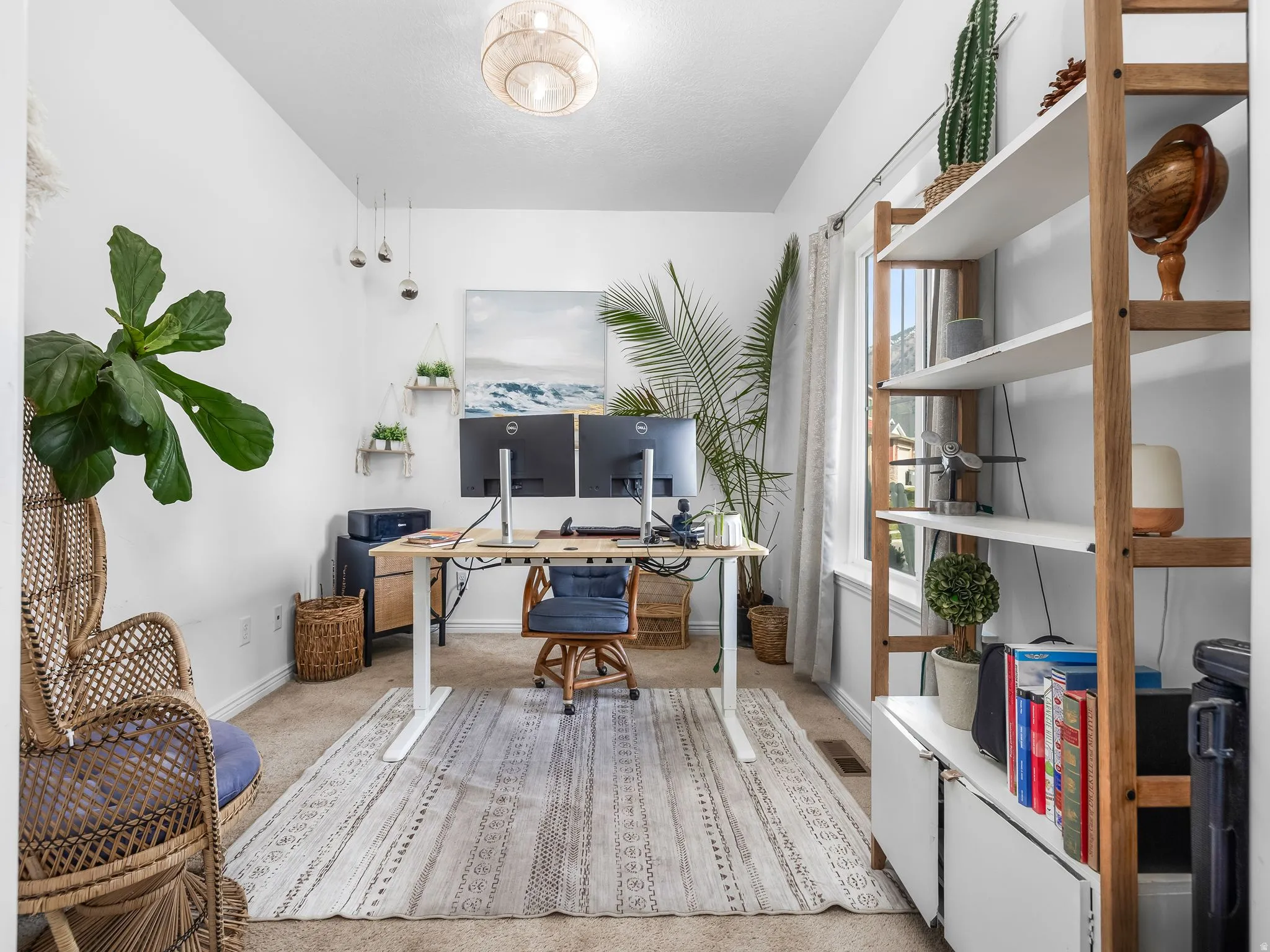 Office area with light colored carpet and baseboards