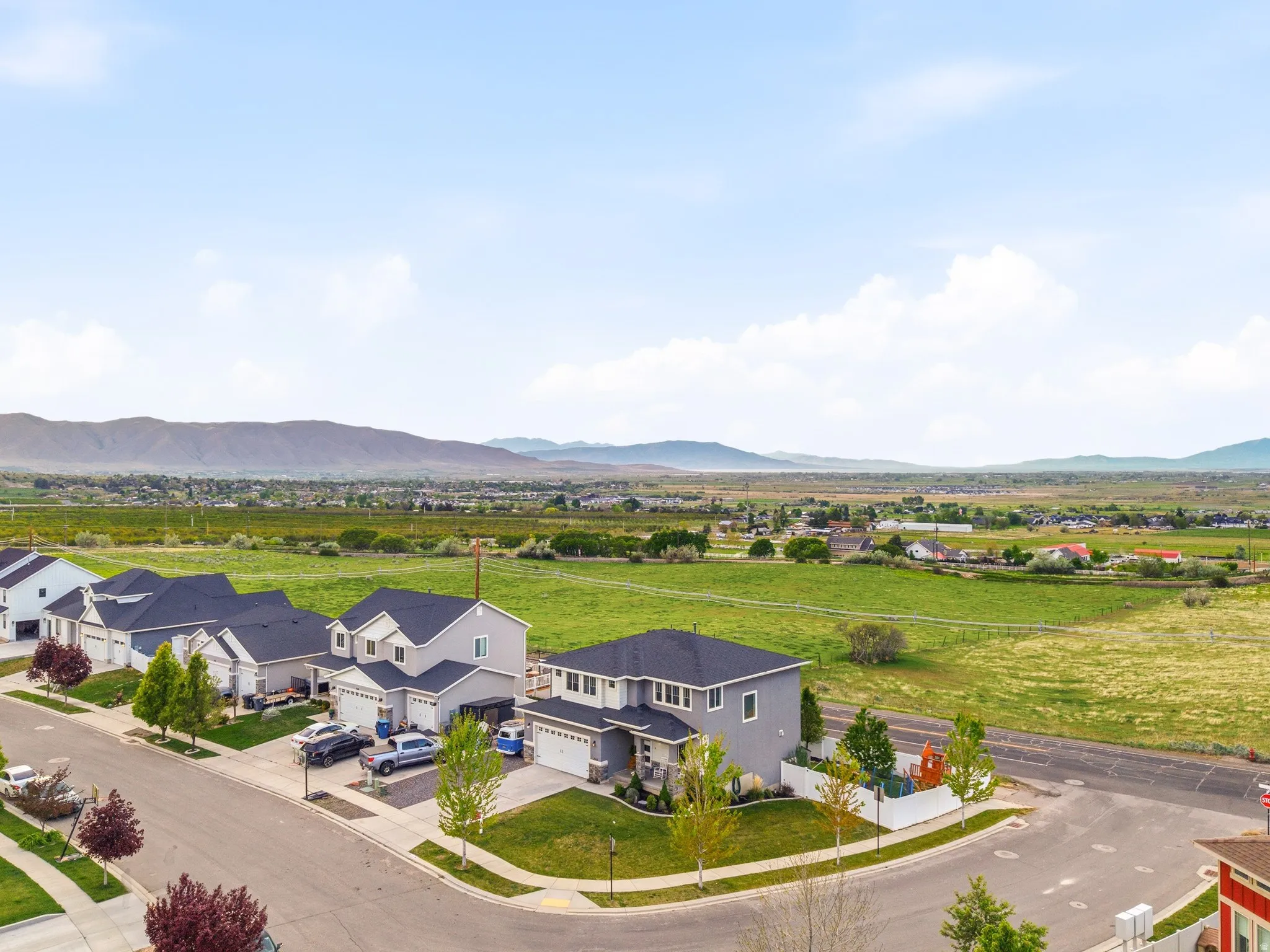 Aerial view of residential area featuring a mountainous background