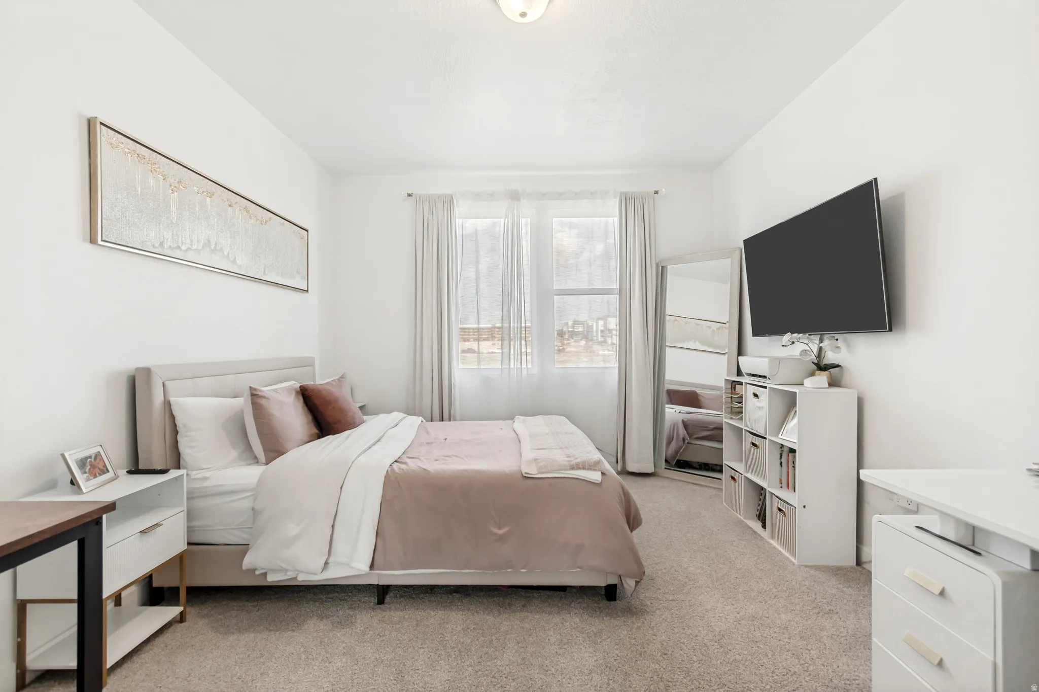 Bedroom with light carpet