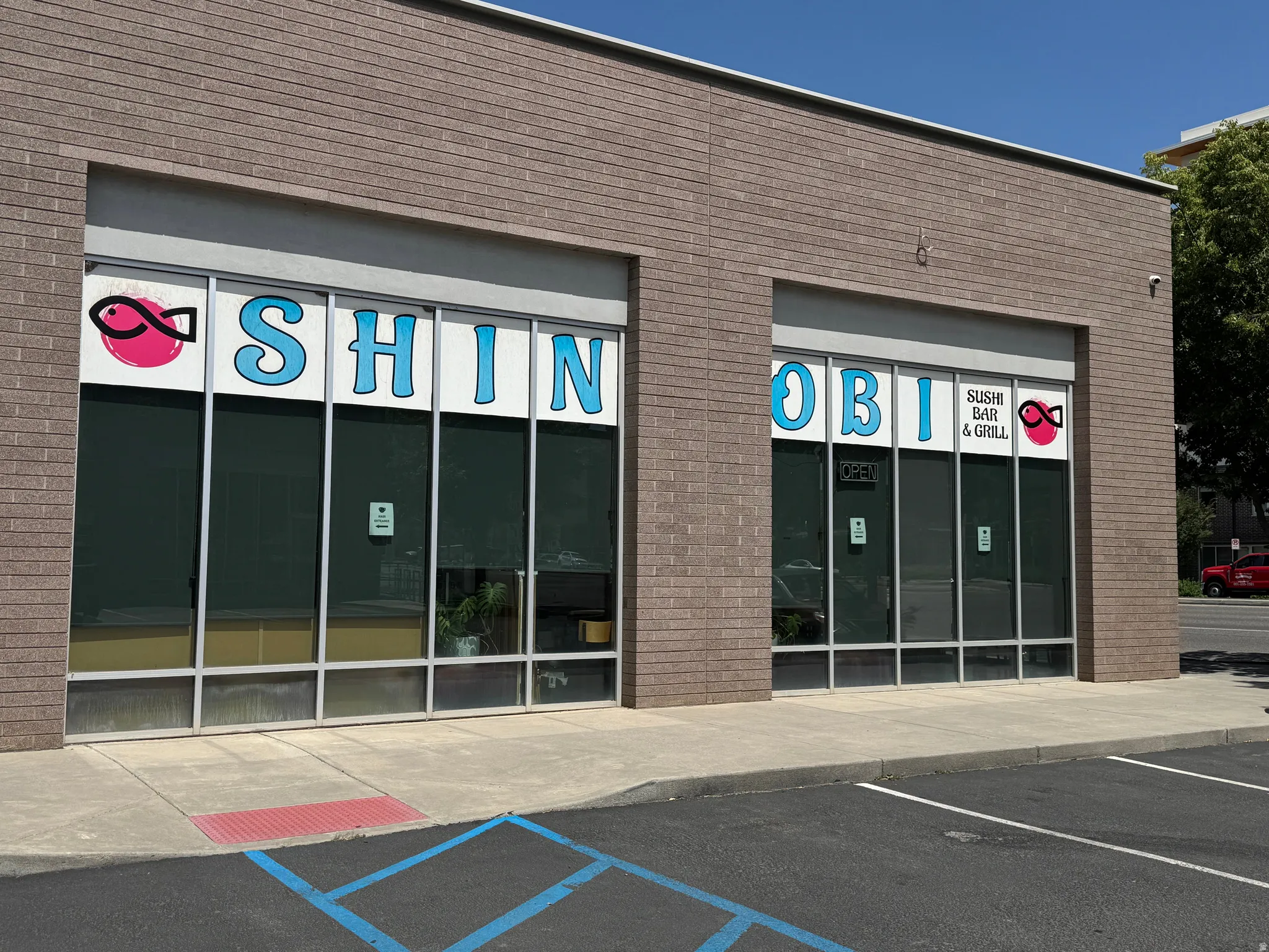 View of commercial location featuring uncovered parking