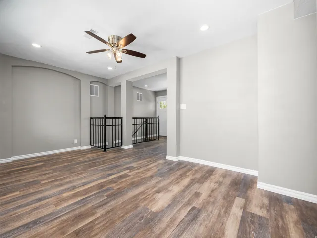 Unfurnished room with recessed lighting, dark wood finished floors, and ceiling fan