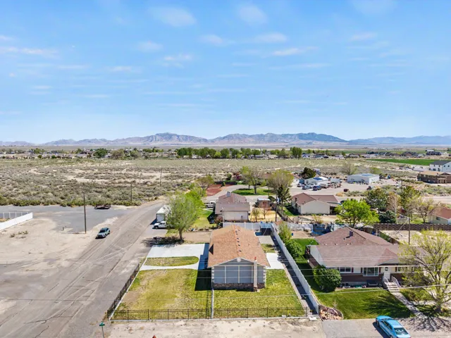 Aerial view of residential area featuring a mountainous background