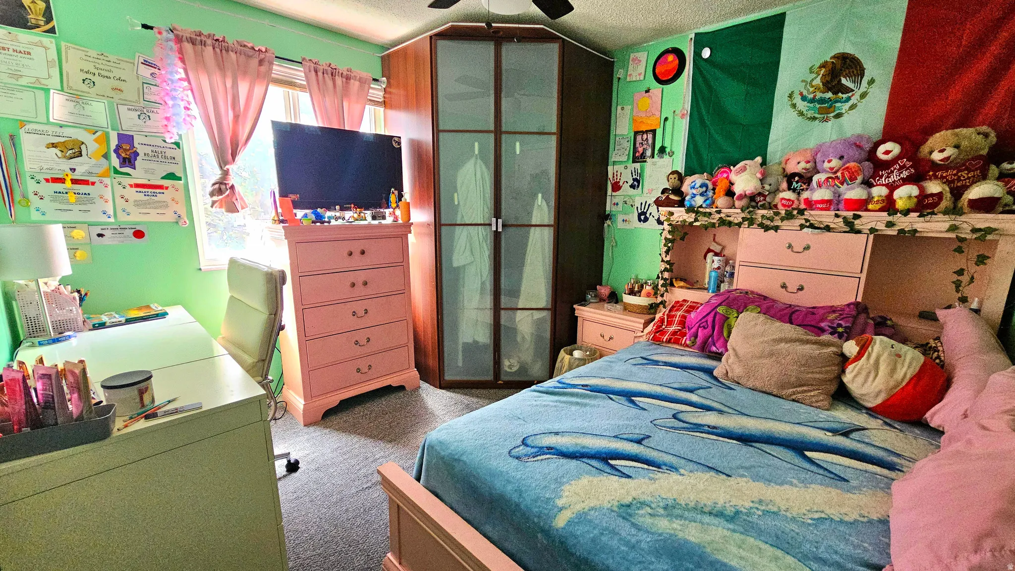 Bedroom featuring dark colored carpet and a ceiling fan