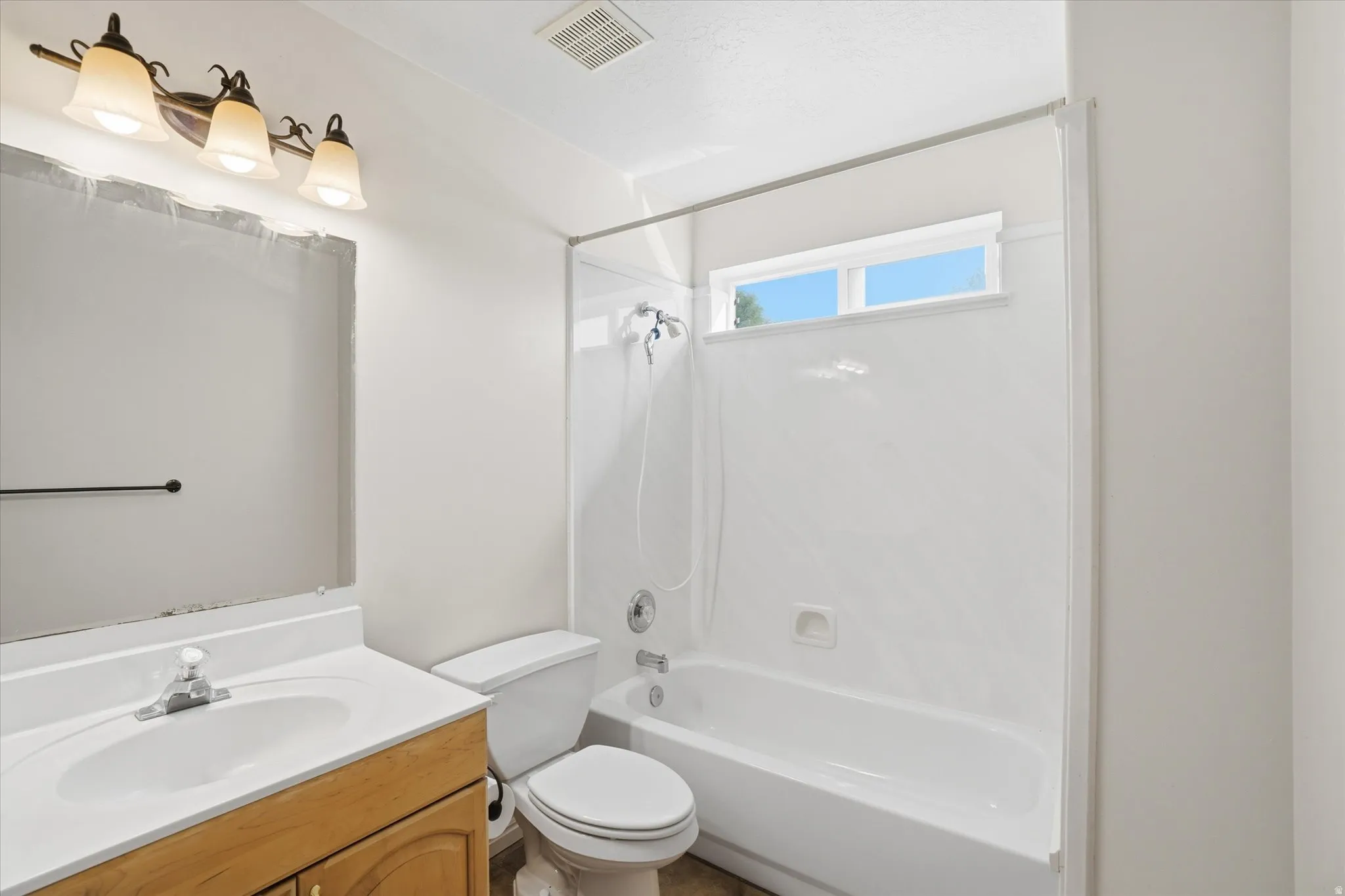 Full bathroom with vanity and shower / tub combination