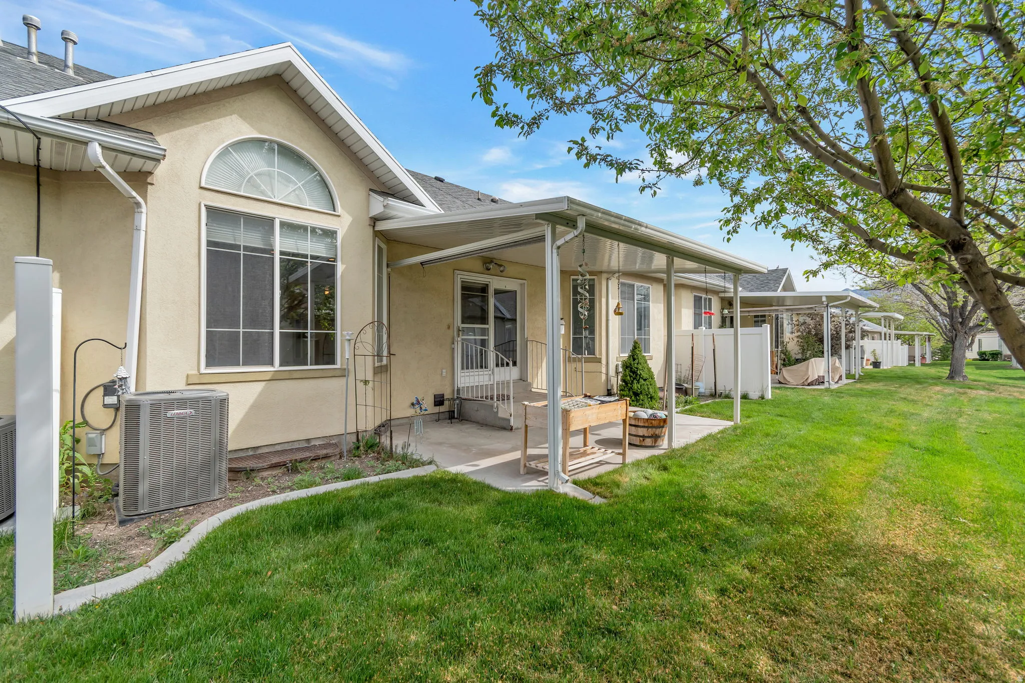 Rear view of property with stucco siding