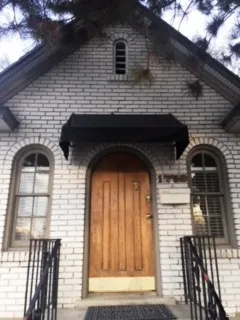 Property entrance with brick siding