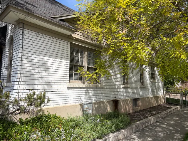 View of property exterior featuring brick siding