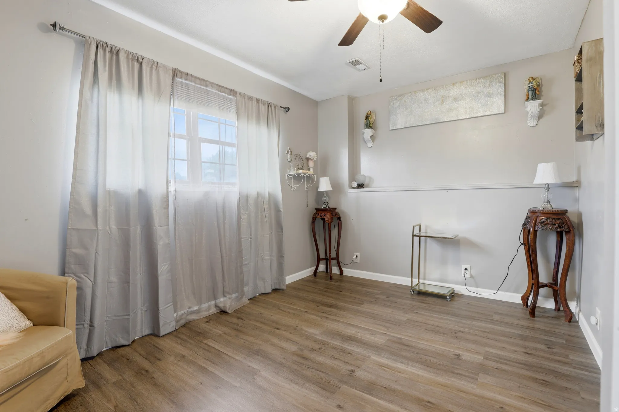 Unfurnished room with ceiling fan and wood finished floors