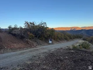 View of dirt / gravel road with a mountain view