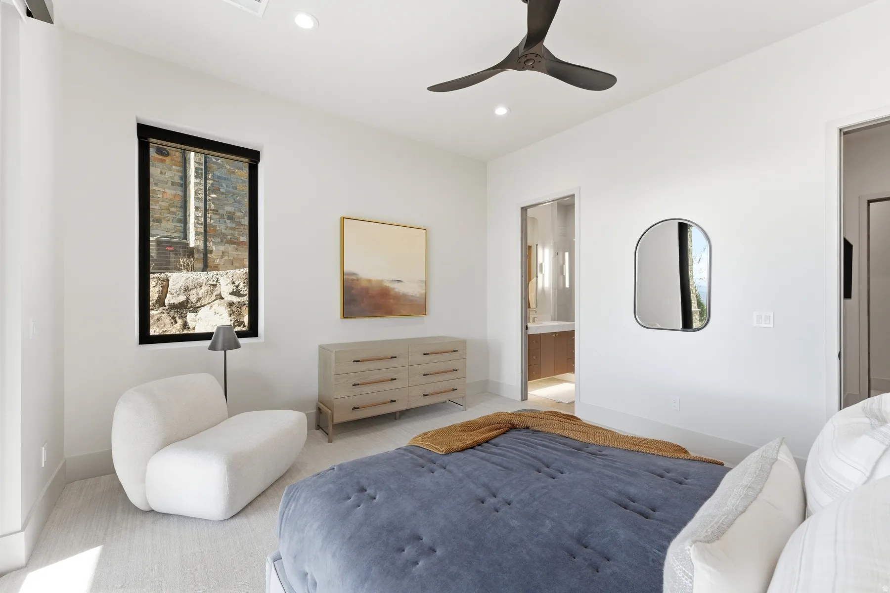 Carpeted bedroom with recessed lighting, ceiling fan, and ensuite bathroom