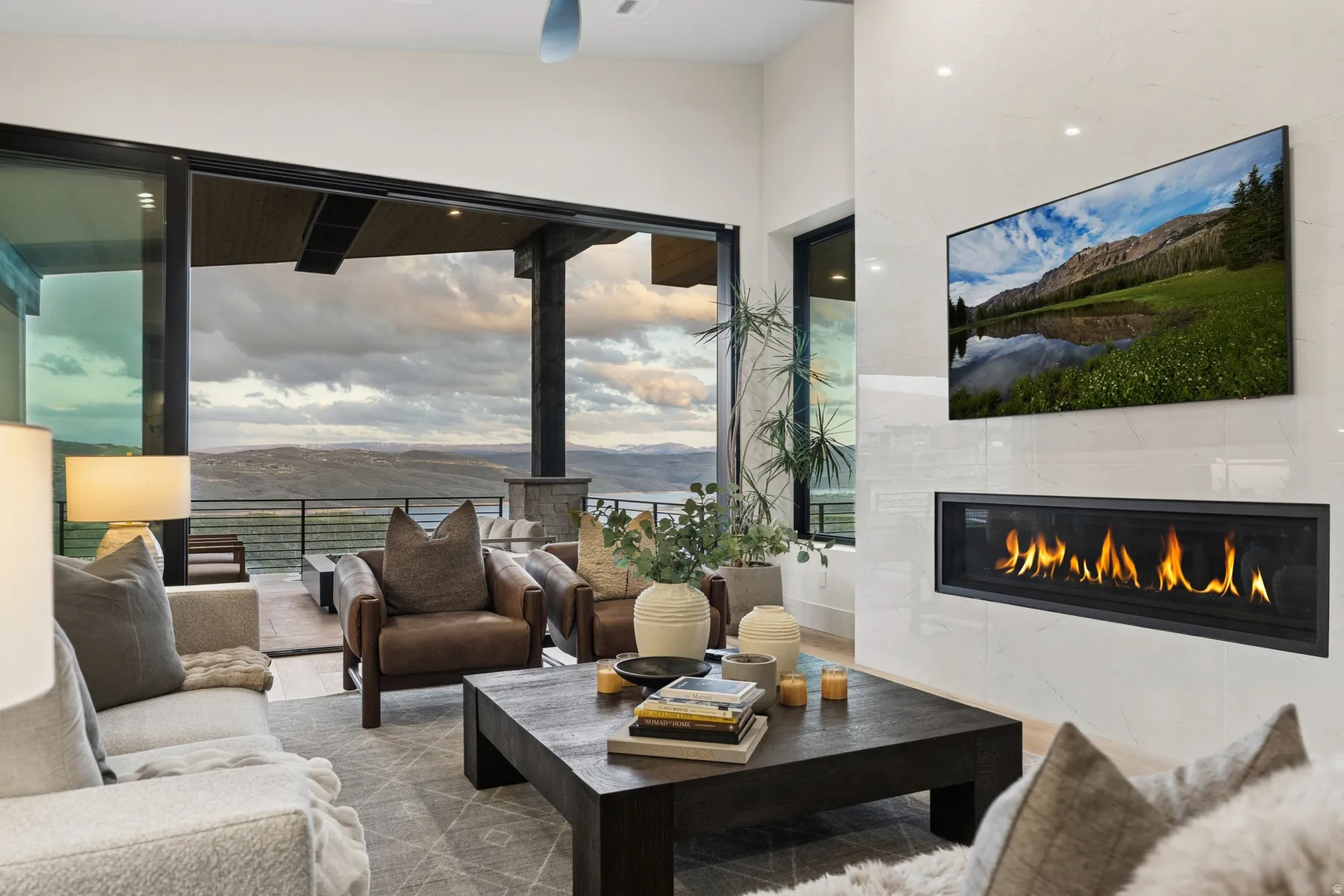 Living area featuring a tiled fireplace and wood finished floors