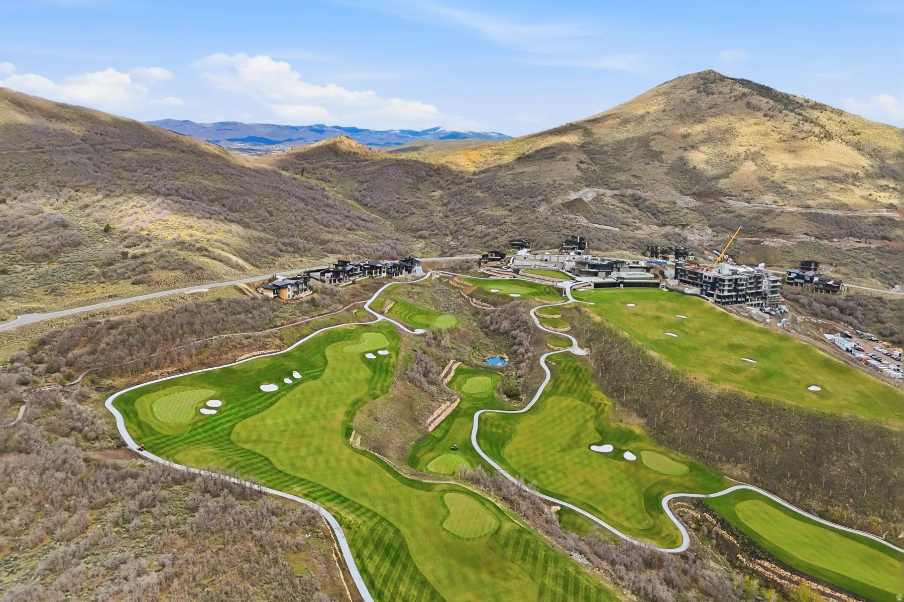 Bird's eye view of a golf club and mountains