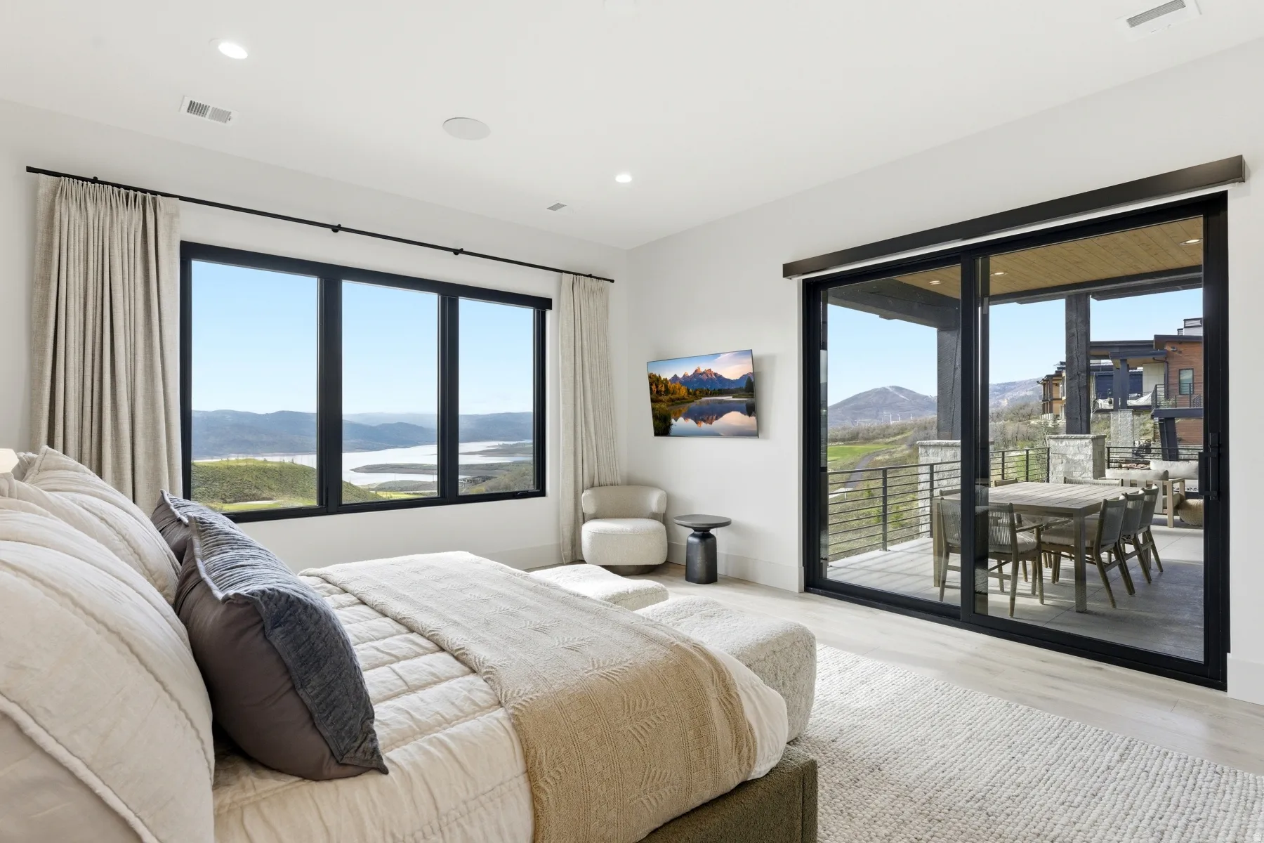 Bedroom featuring light wood-style floors, access to exterior, and recessed lighting