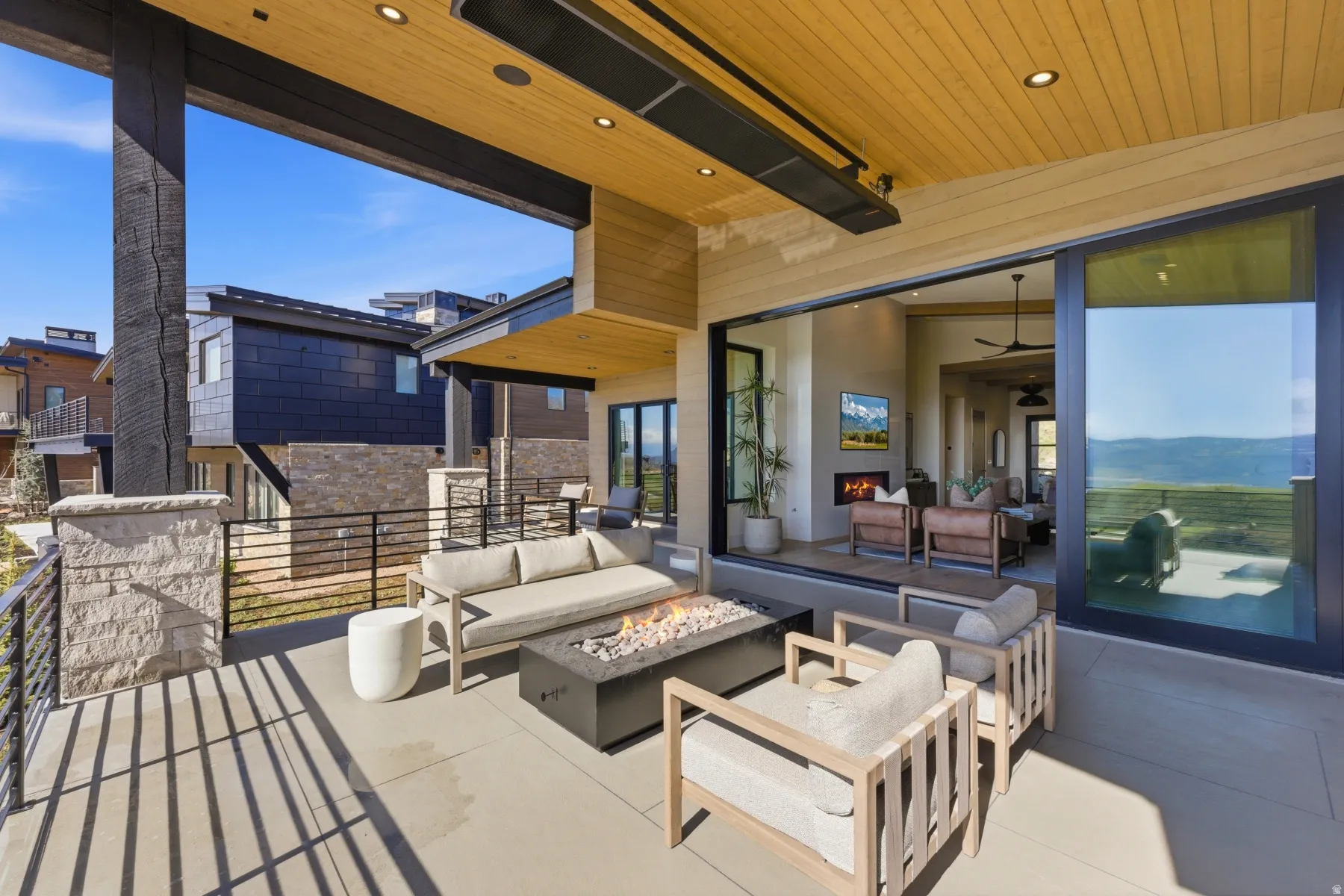 View of patio / terrace featuring an outdoor living space with a fire pit
