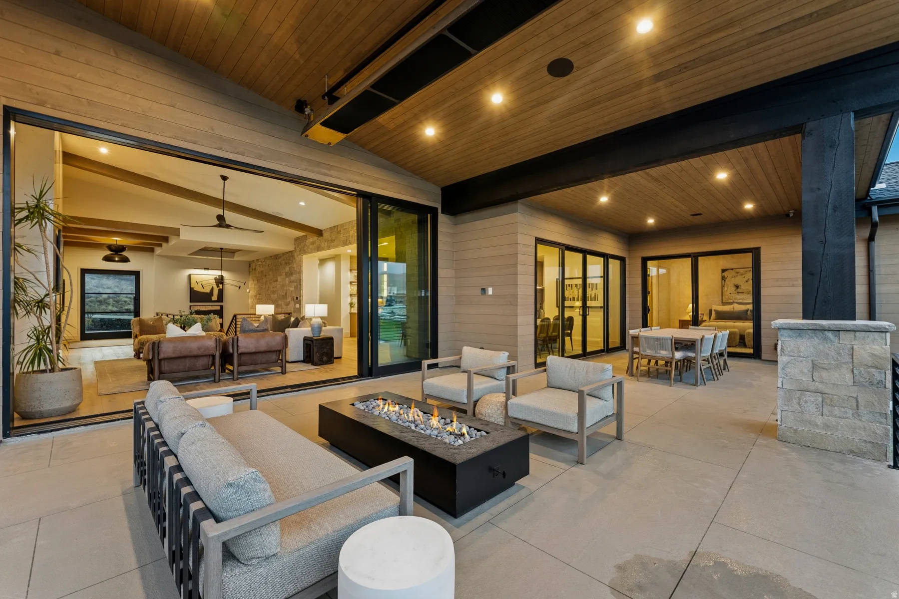 View of patio with outdoor lounge area and an outdoor fire pit