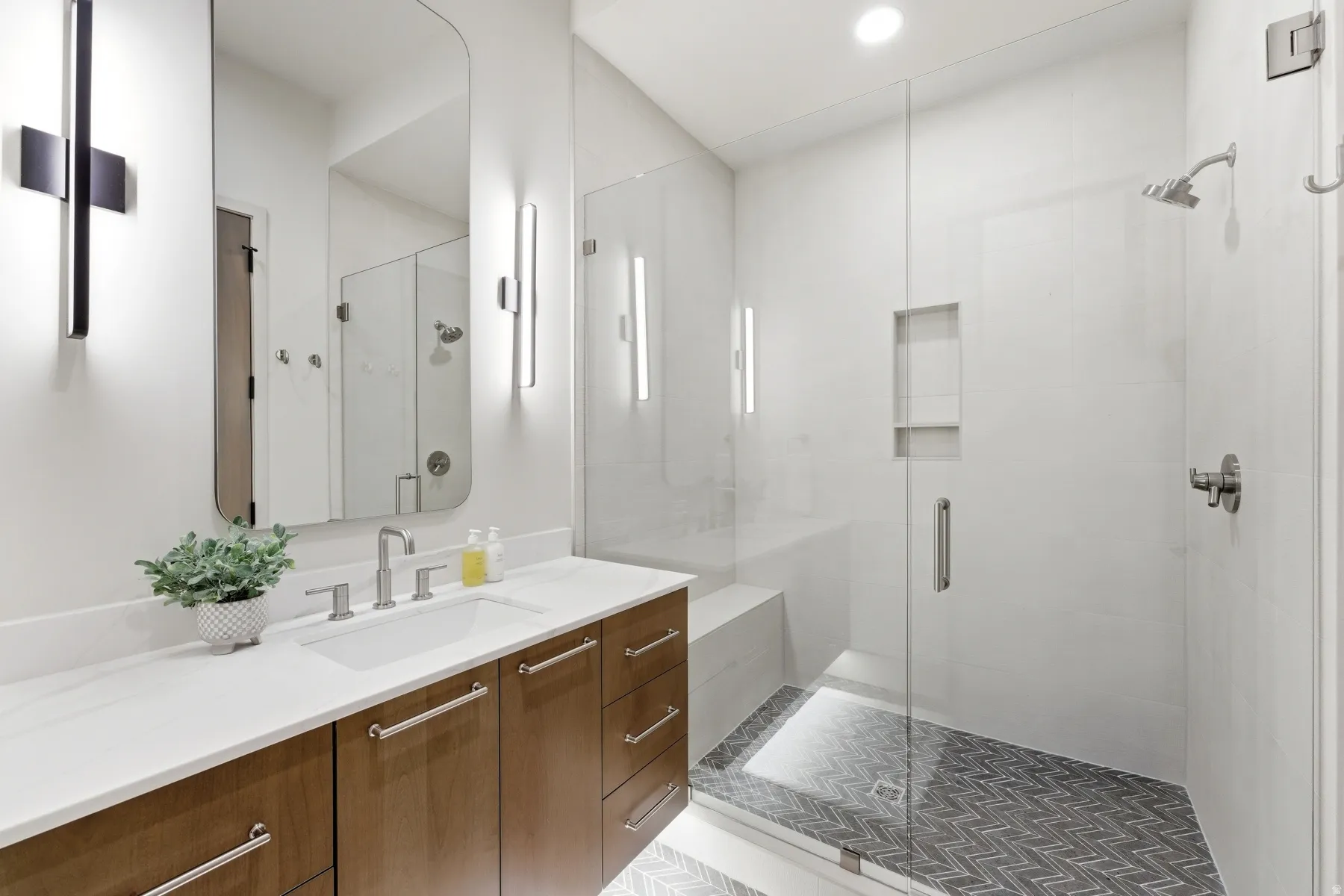 Full bathroom featuring vanity and a stall shower