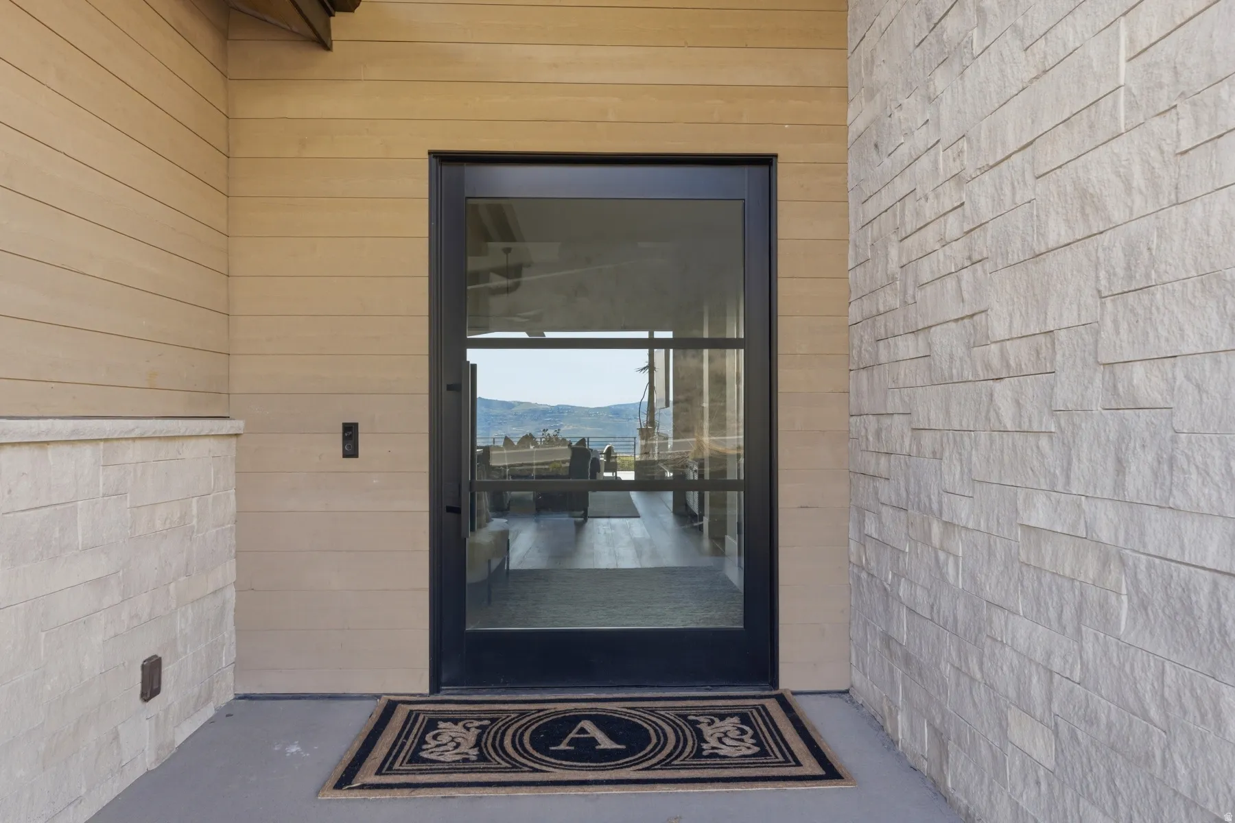 View of exterior entry with a mountain view