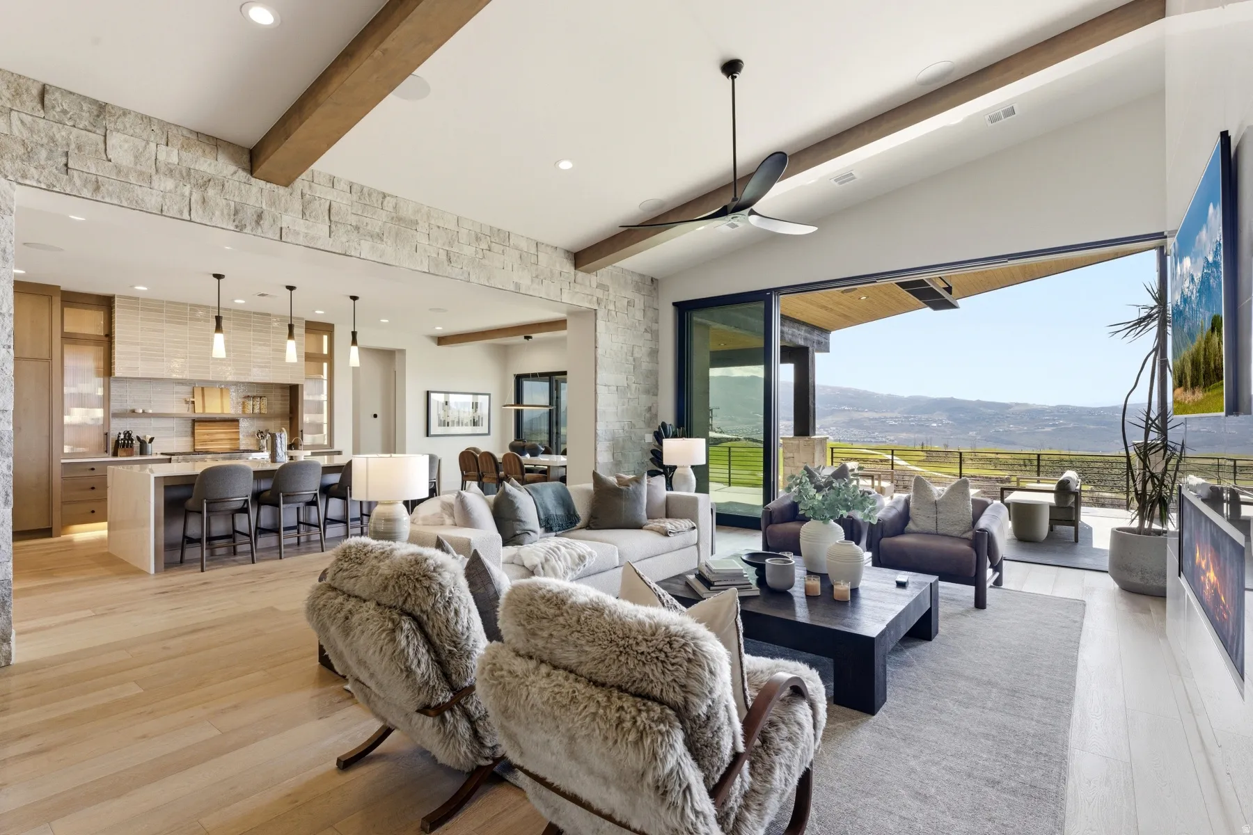 Living room with beamed ceiling, ceiling fan, a mountain view, light wood-type flooring, and recessed lighting
