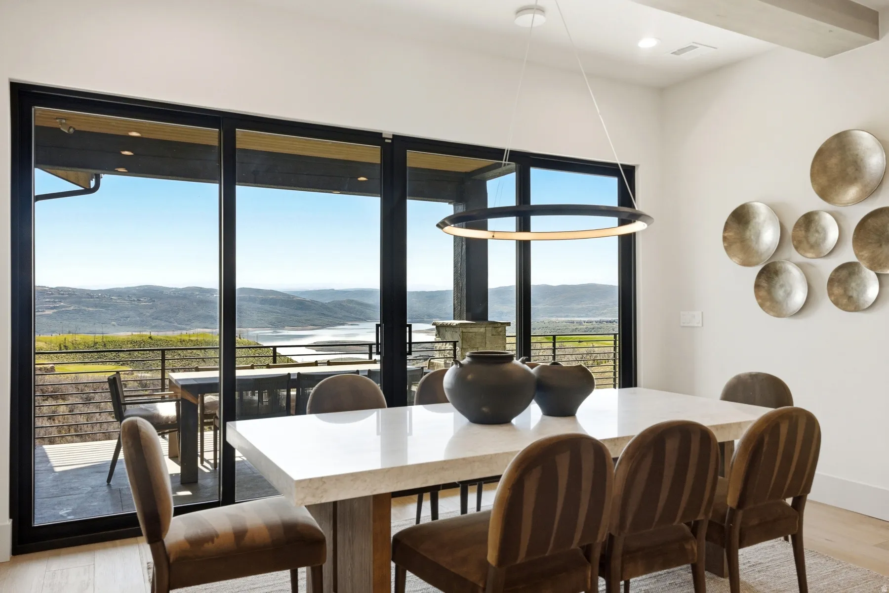Dining area featuring light wood-style flooring, a mountain view, and recessed lighting