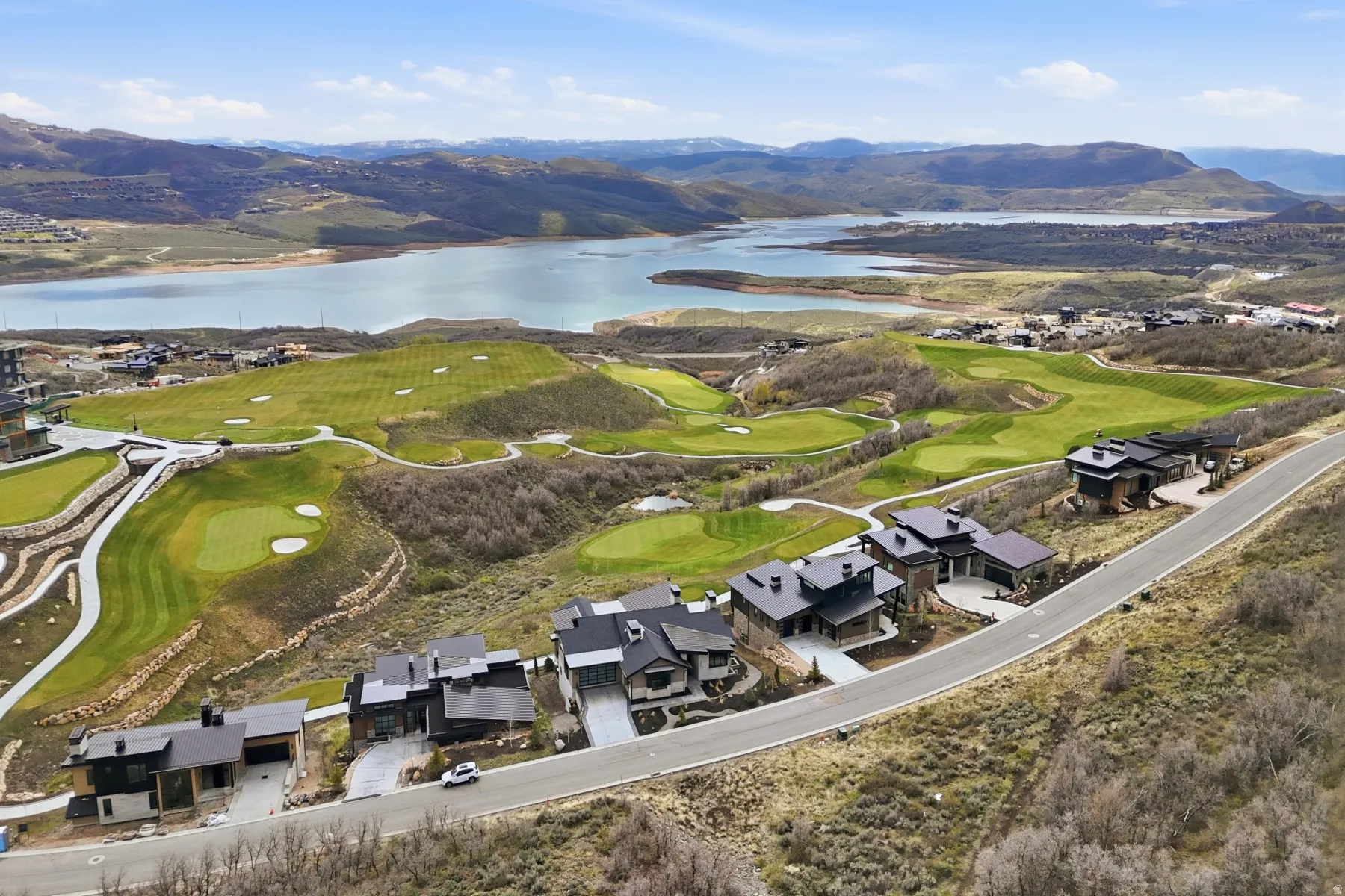 Aerial view of a water and mountain view and a golf course