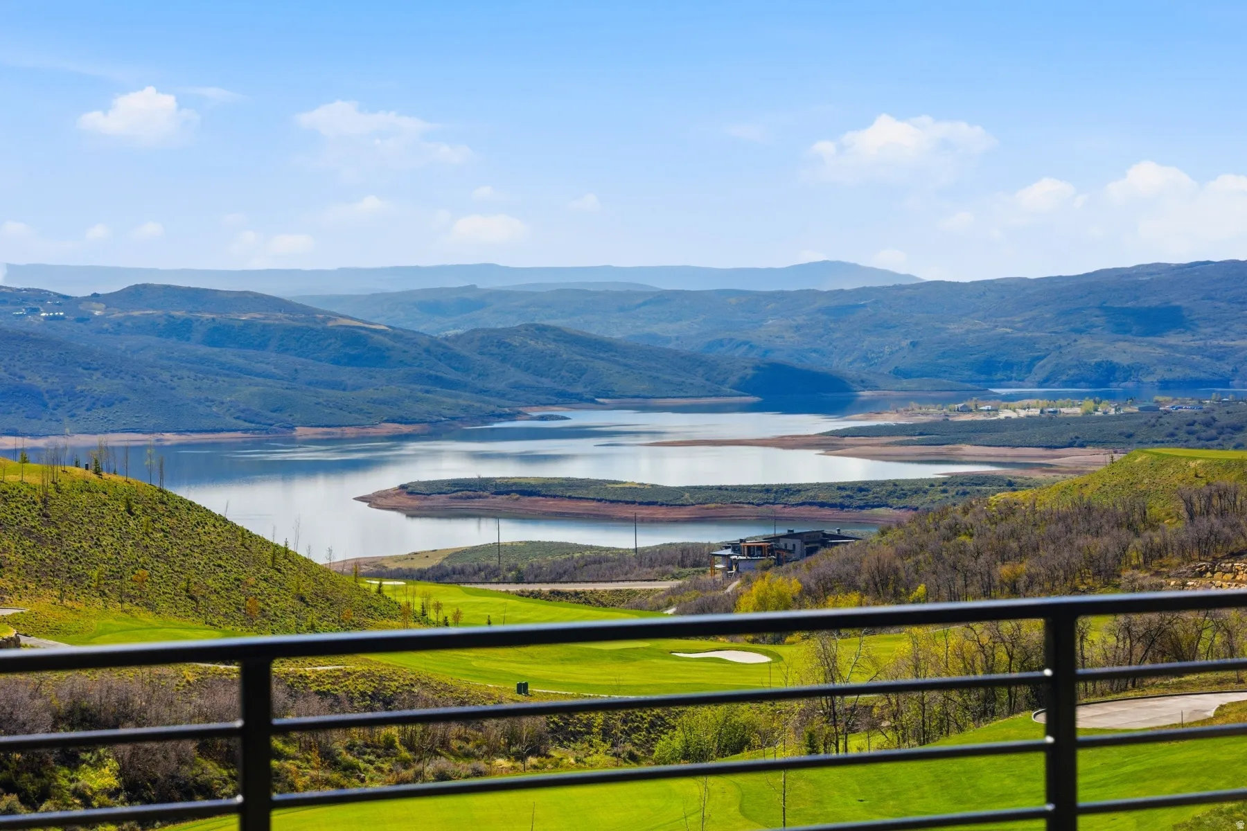 View of mountain backdrop featuring a nearby body of water