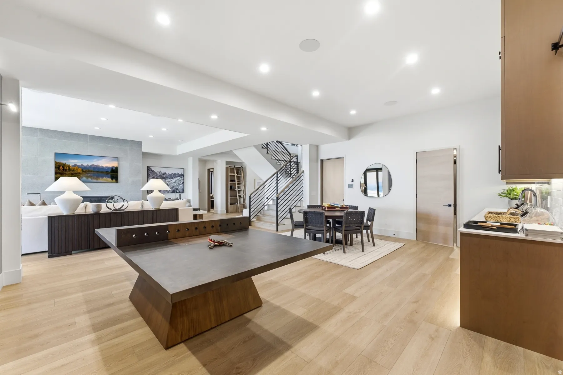 Kitchen with light wood-style flooring, recessed lighting, a kitchen island, and open floor plan