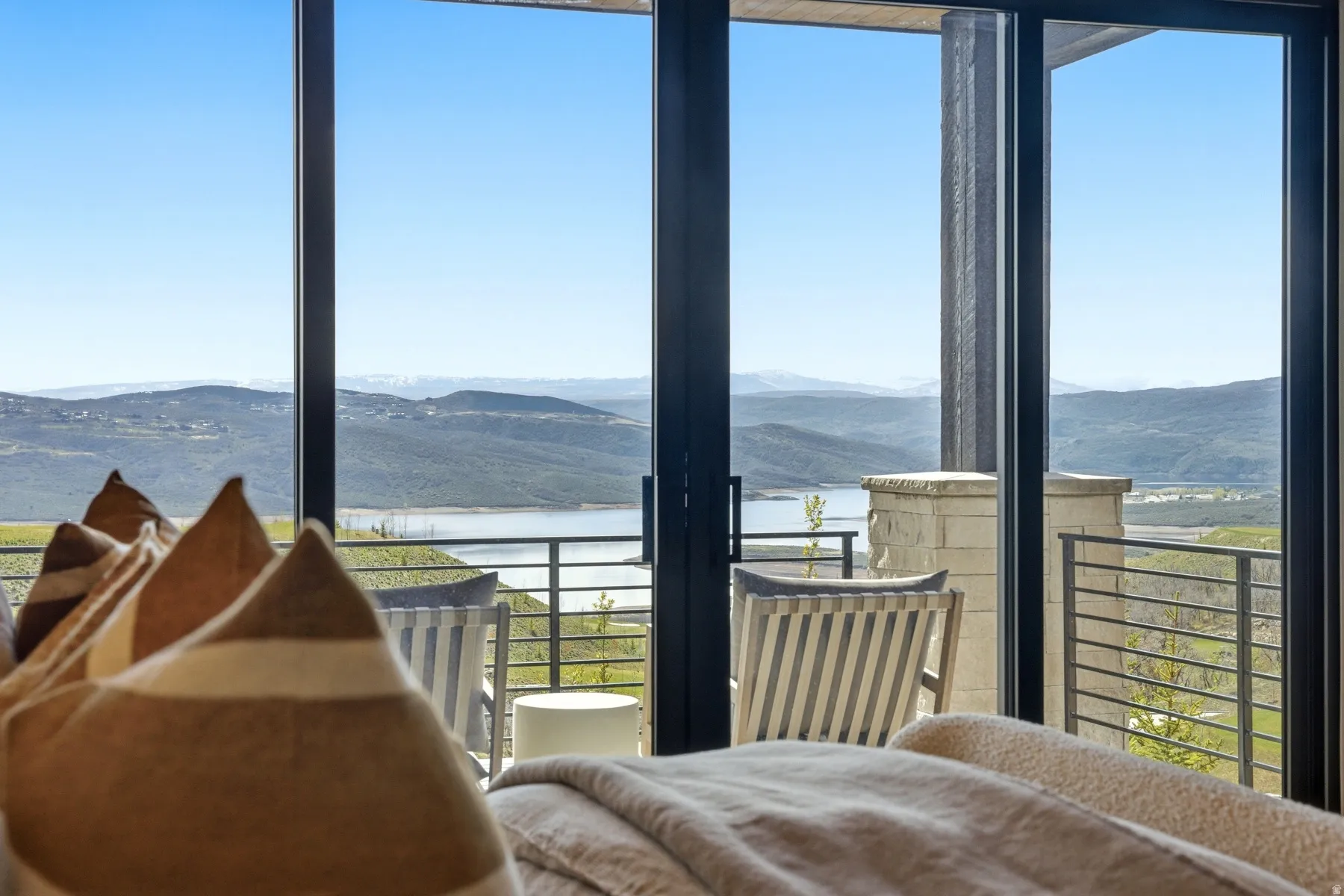 Bedroom with a water and mountain view