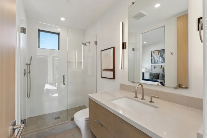 Full bath with ensuite bath, vanity, a stall shower, and recessed lighting