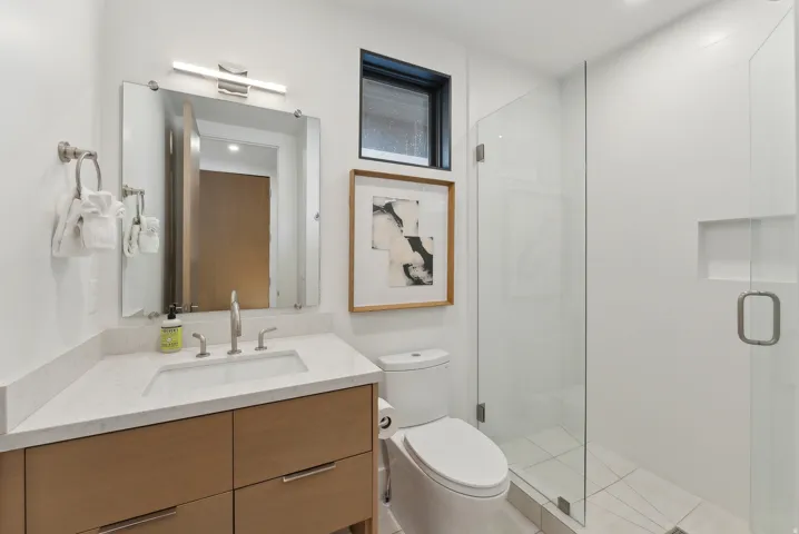Bathroom featuring vanity, a shower stall, and recessed lighting