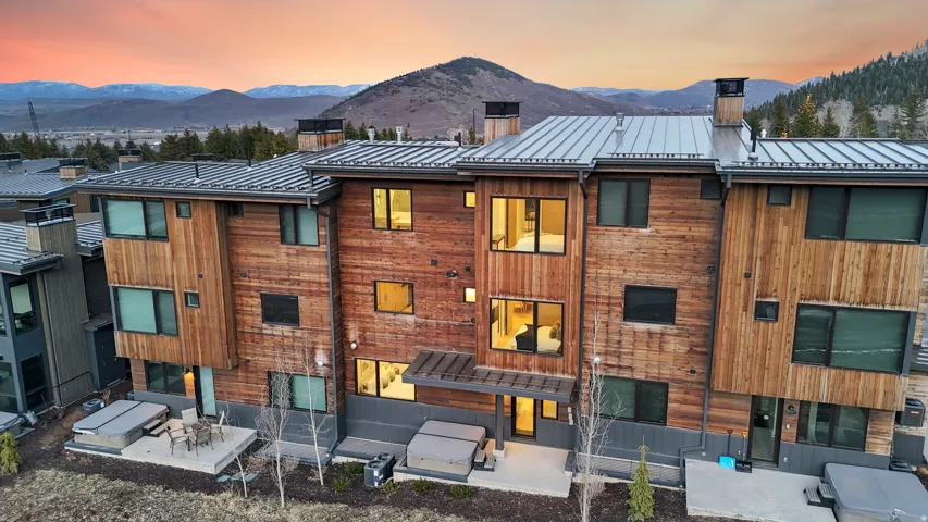 Property at dusk featuring a mountain view