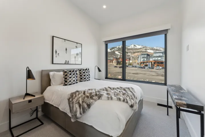 Carpeted bedroom featuring a mountain view and recessed lighting