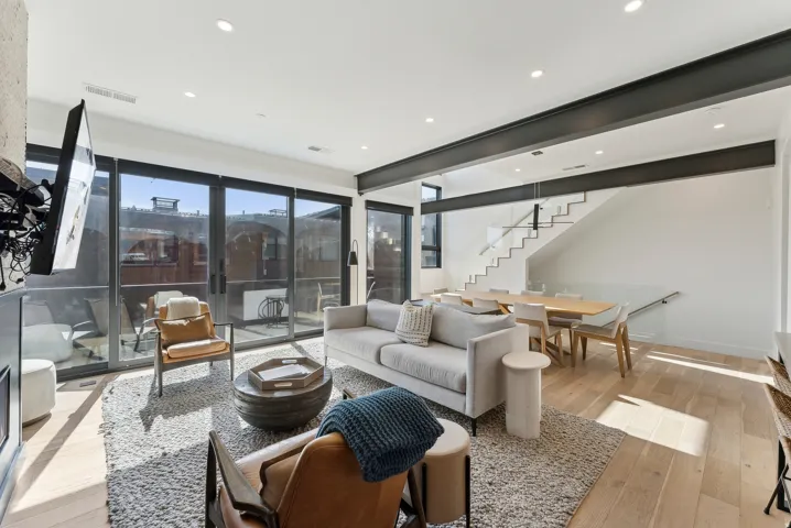 Living room featuring light wood finished floors and recessed lighting