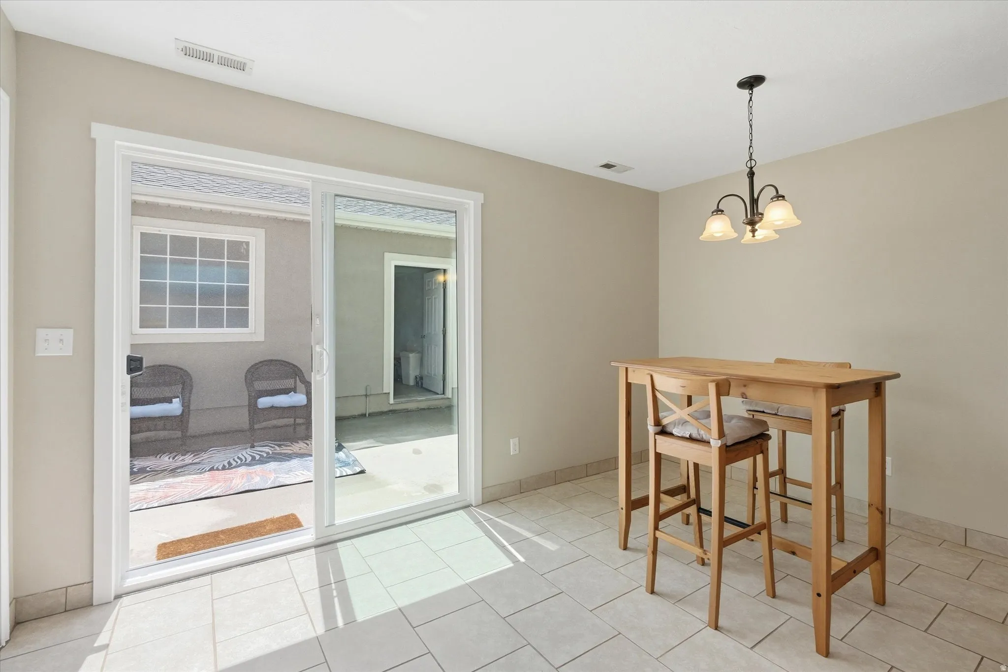 Sliding glass door opening to a concrete patio
