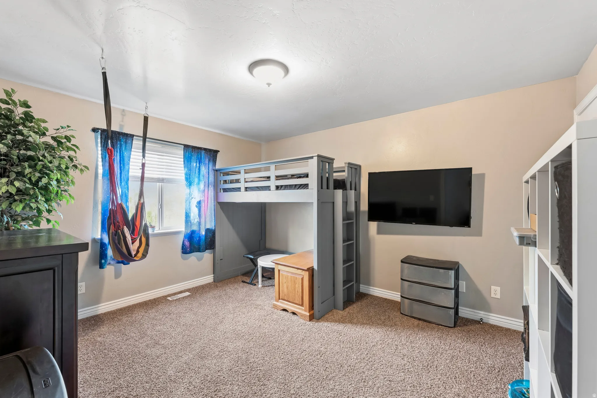 Unfurnished bedroom featuring baseboards and light colored carpet